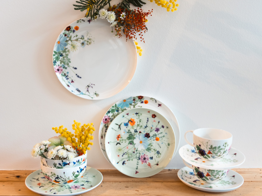 Rosenthal Brillance tableware by Regula Stüdli with floral designs, decoratively arranged with flowers.