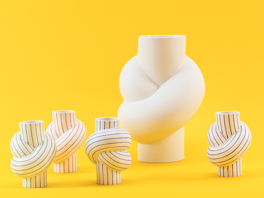 The Node vase by Martin Hirth for Rosenthal in white with colorful stripes, against a yellow background.