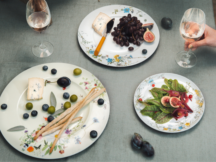 Rosenthal tableware Brillance by Regula Stüdli with cheese, grapes, figs, and rosé wine on a set tabl