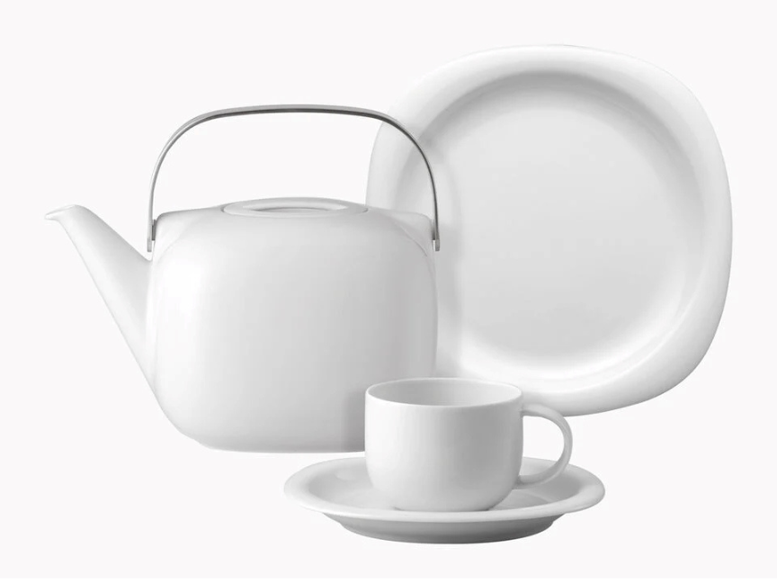 Teapot, plate and cup with saucer from the Suomi collection against a white background