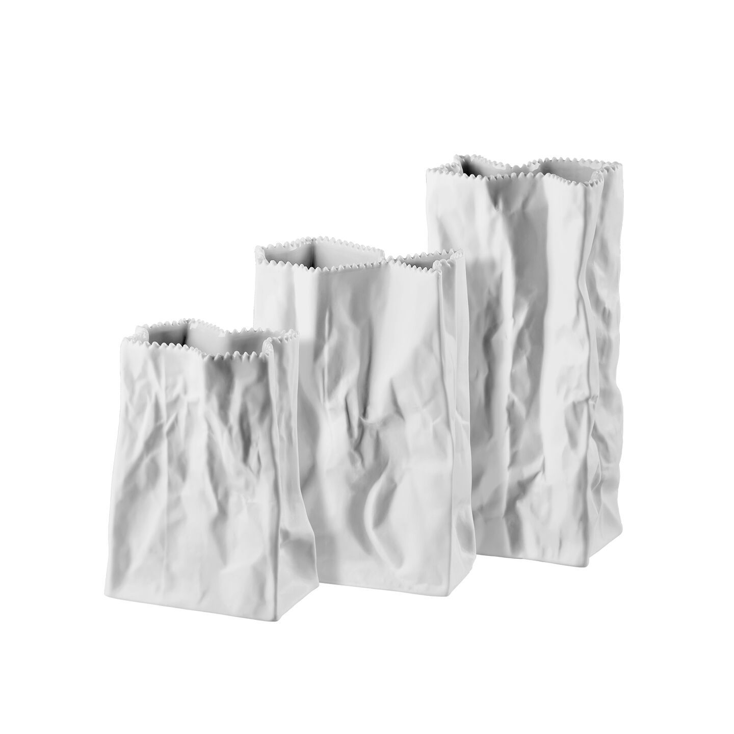 three white paperbag vases in various sizes against a white backdrop