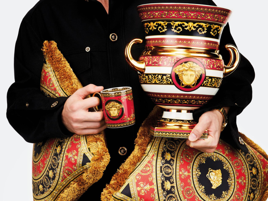 Rosenthal meets Versace tableware and home accessories with red and gold Medusa design – mug, vase and cushions