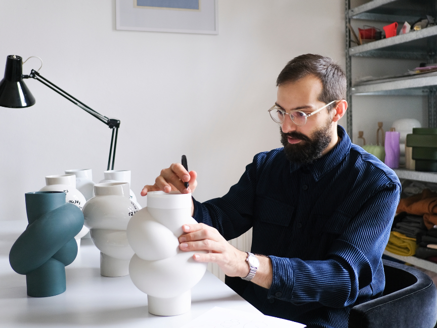 Martin Hirth, designer at Rosenthal, working on the Node vase and sketching the design.