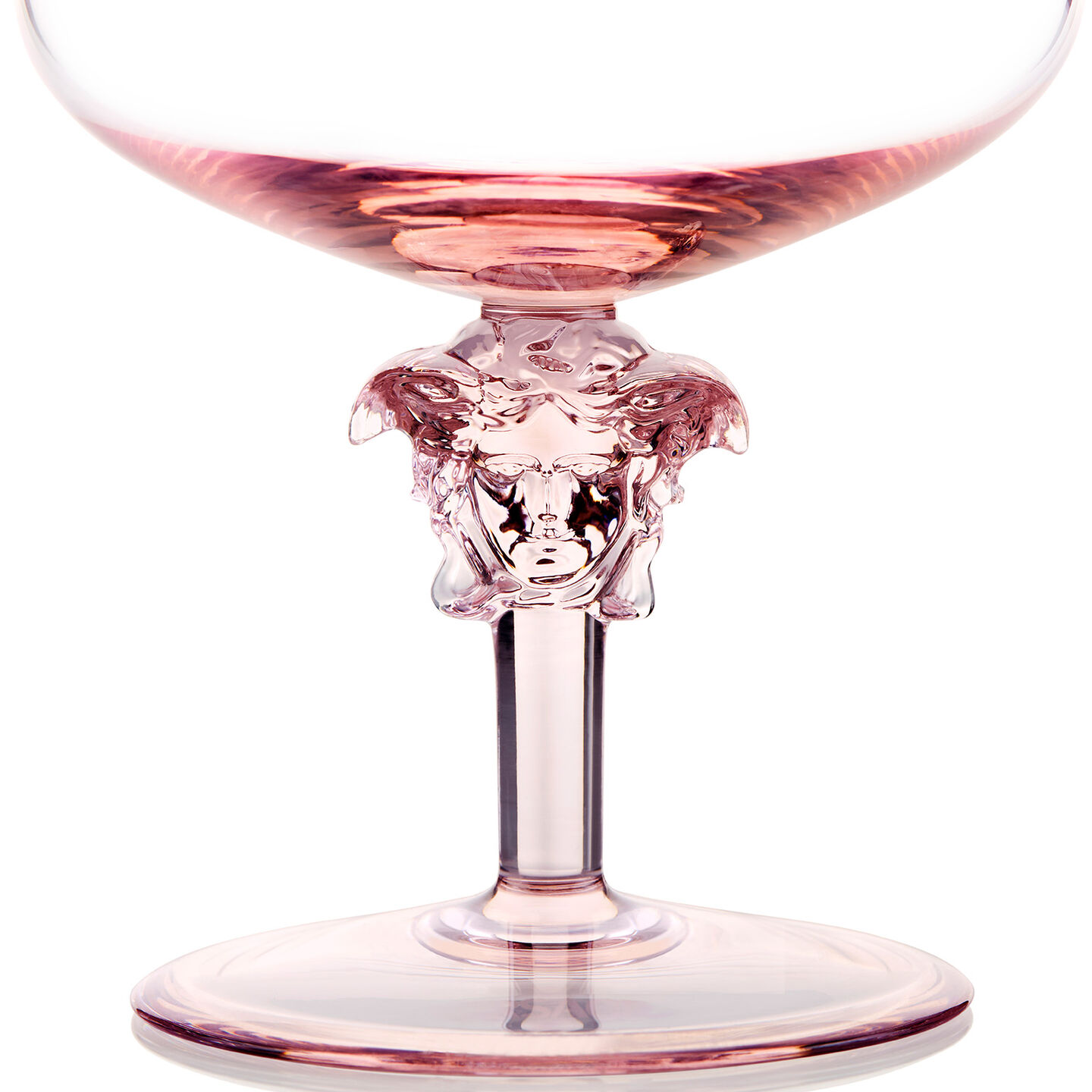 Rosenthal meets Versace Medusa Lumi&egrave;re 2nd edition Sektkelche vor einer pinken Torte