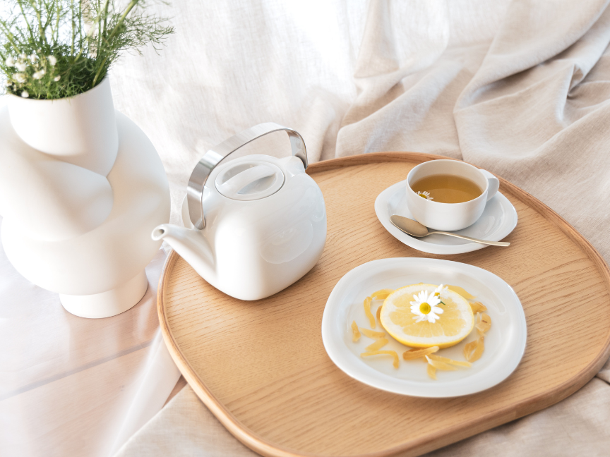 Teapot, teacup, saucer and plate from the Suomi collection on a tray.