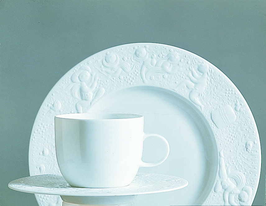 Modern white Rosenthal porcelain set including teapot, cup with saucer, and plate in a minimalist design.