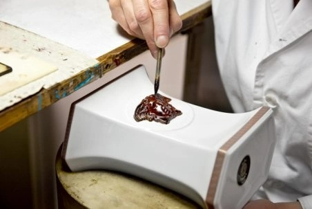 The Medusa head is painted by hand with a brush in unfired condition.