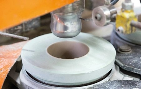 Illustration of the turning process based on a cup in porcelain production